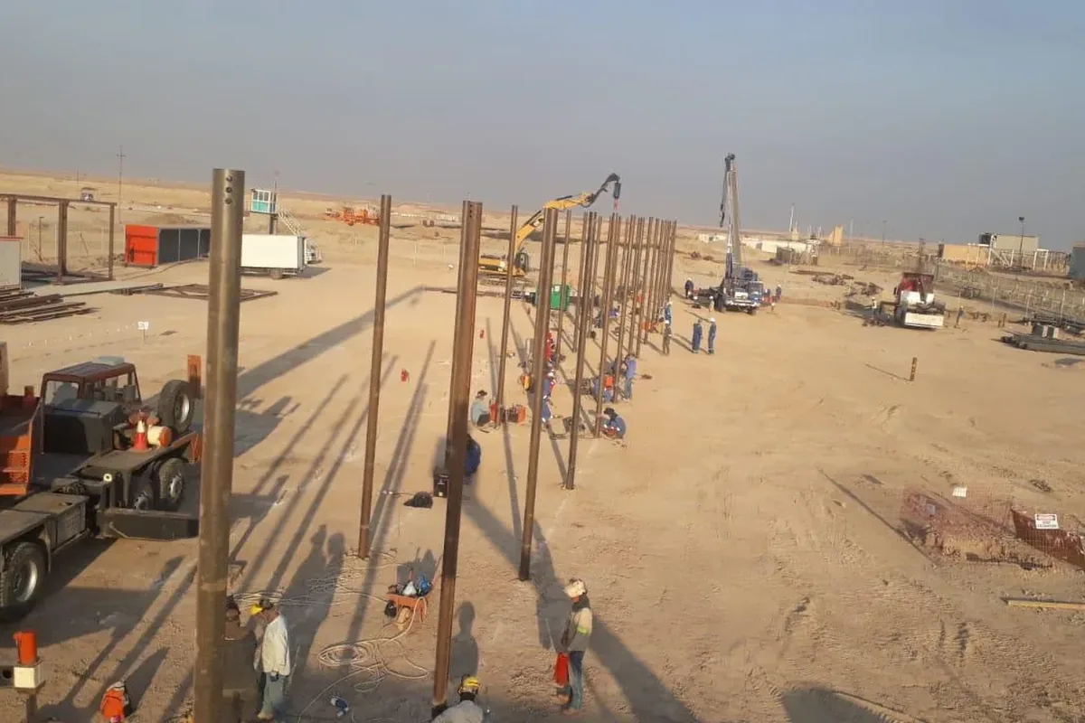 Rows of helical piles for pipeline supports, Basra, Iraq